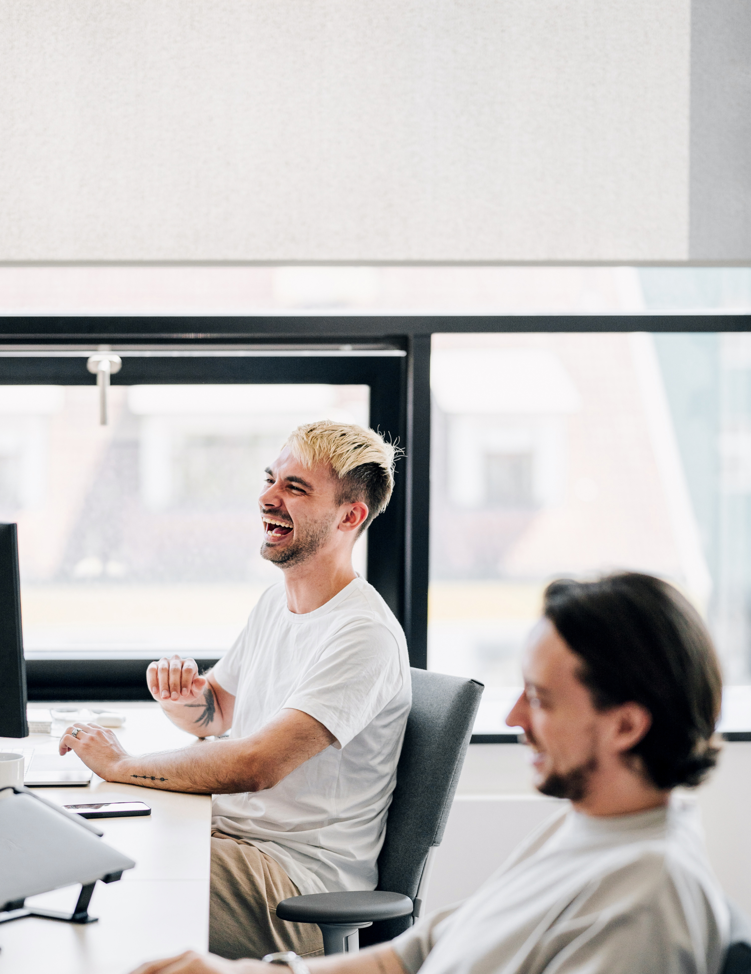 Marketing team laughing at a brainstorm session